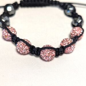 Shamballa style bracelet. Pink rhinestones adjustable